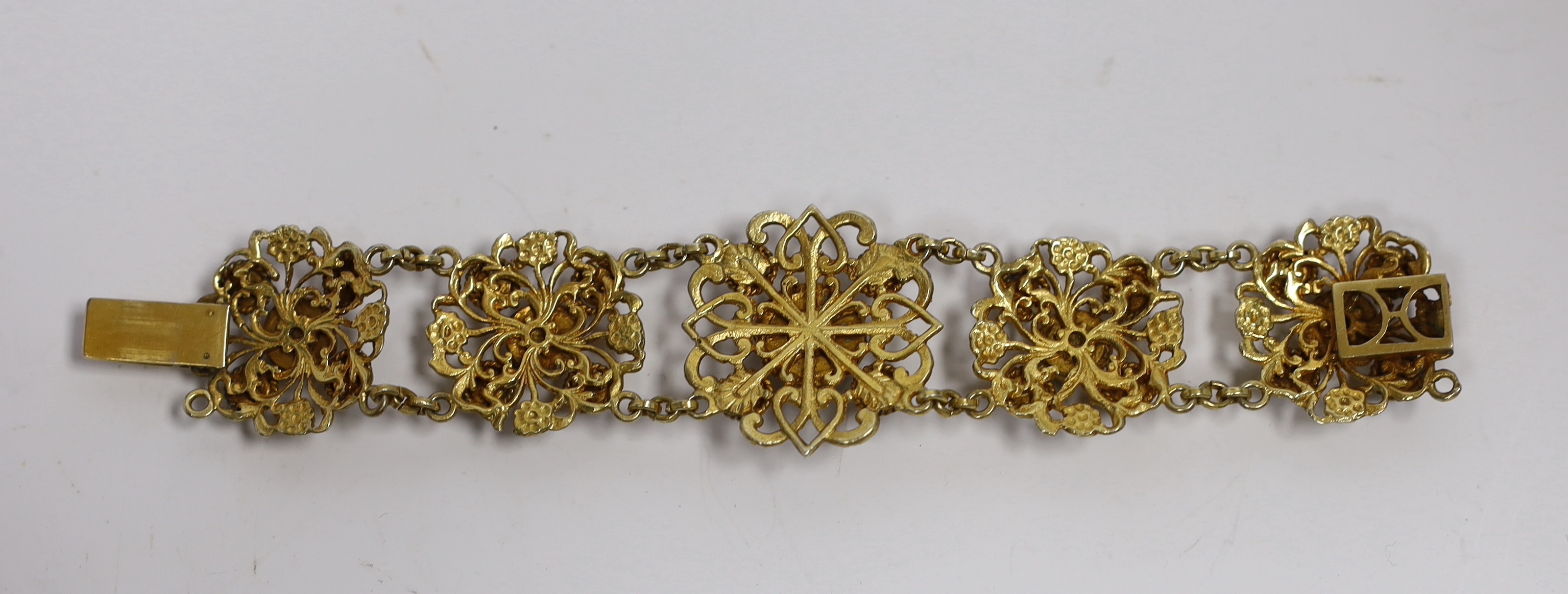 A Continental gilt metal bracelet inset with cabochon, garnets and pastes, length 15.5cm